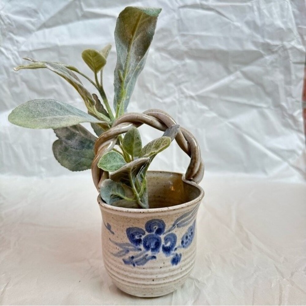 Artisan handmade glazed pottery twisted handle basket w/ blue floral design